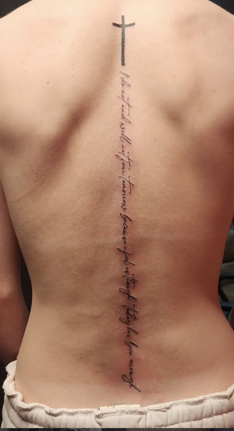 Spine script tattoo