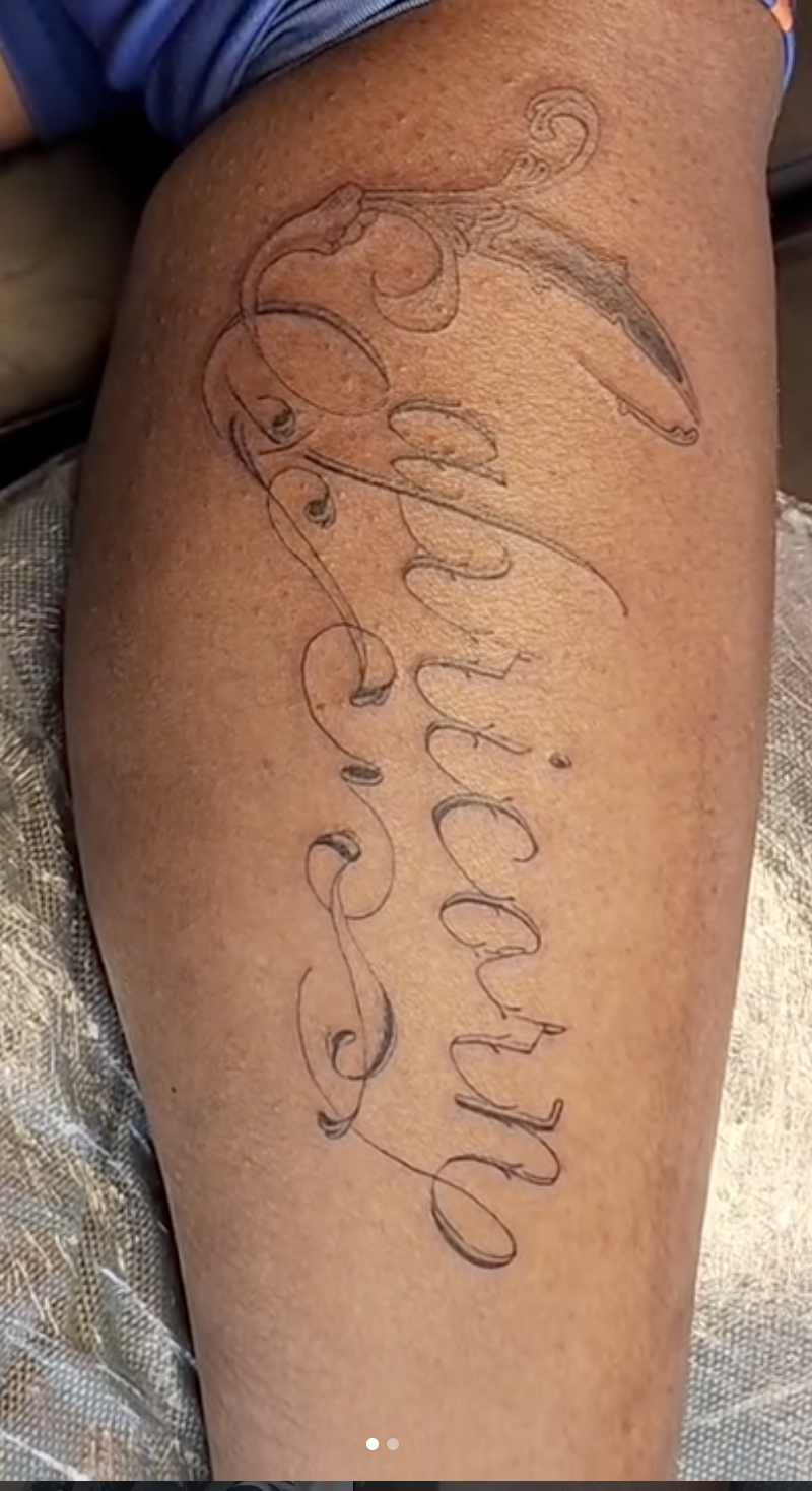 Calf lettering tattoo
